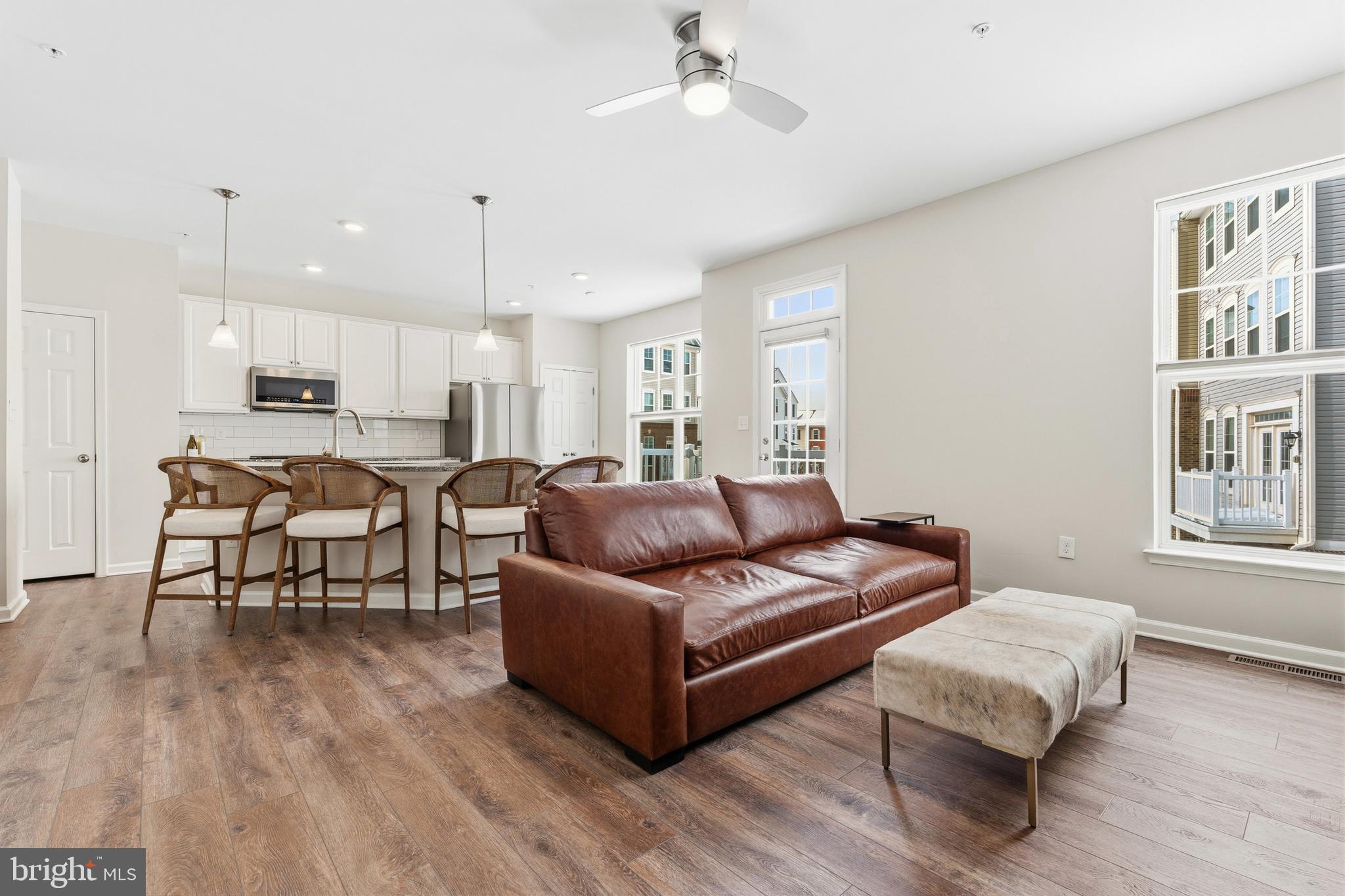 5902 Forum Square Frederick, MD 21703 - Photo 4 of 28 a living room with furniture and kitchen view