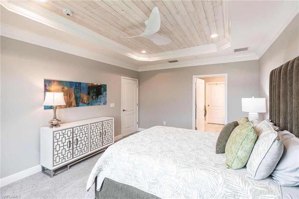 2319 Sawyers Hill Road, Unit 703 Naples, FL 34120 - Photo 16 of 35 a bedroom with a bed window and a dresser