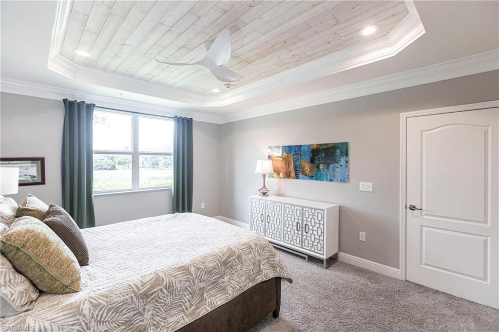 2319 Sawyers Hill Road, Unit 703 Naples, FL 34120 - Photo 17 of 35 a bedroom with a bed and a window