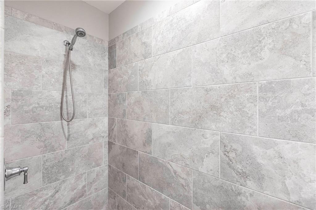 2319 Sawyers Hill Road, Unit 703 Naples, FL 34120 - Photo 22 of 35 a bathroom with a shower