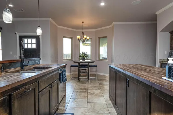a kitchen with a table and chairs in it