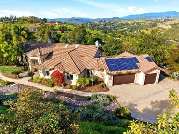 an aerial view of a house with a garden