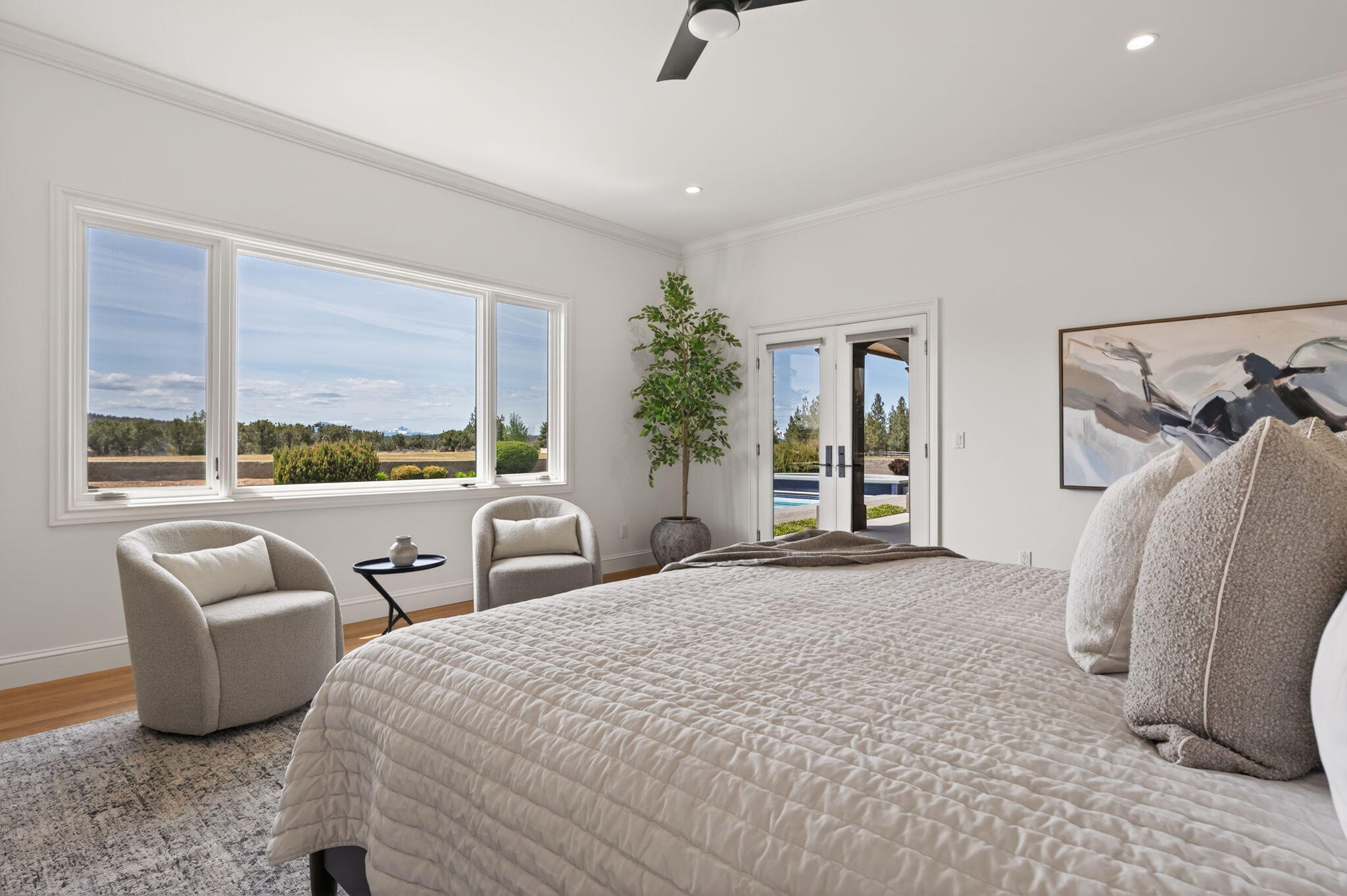 20180 Winston Loop Bend, OR 97703 - Photo 21 of 59 a bedroom with furniture and a large window