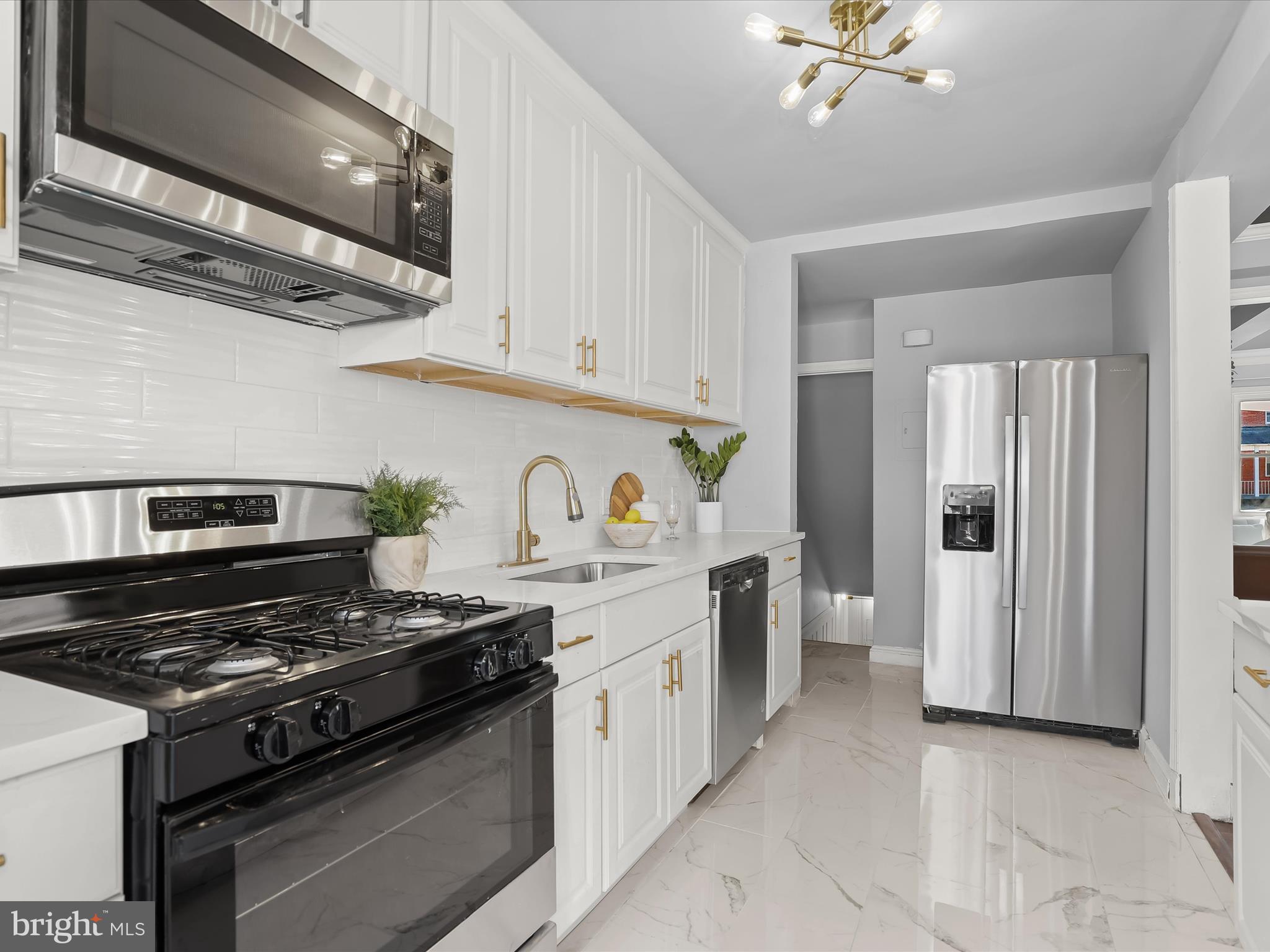 1350 Pentwood Road Baltimore, MD 21239 - Photo 17 of 37 a kitchen with a stove and a refrigerator