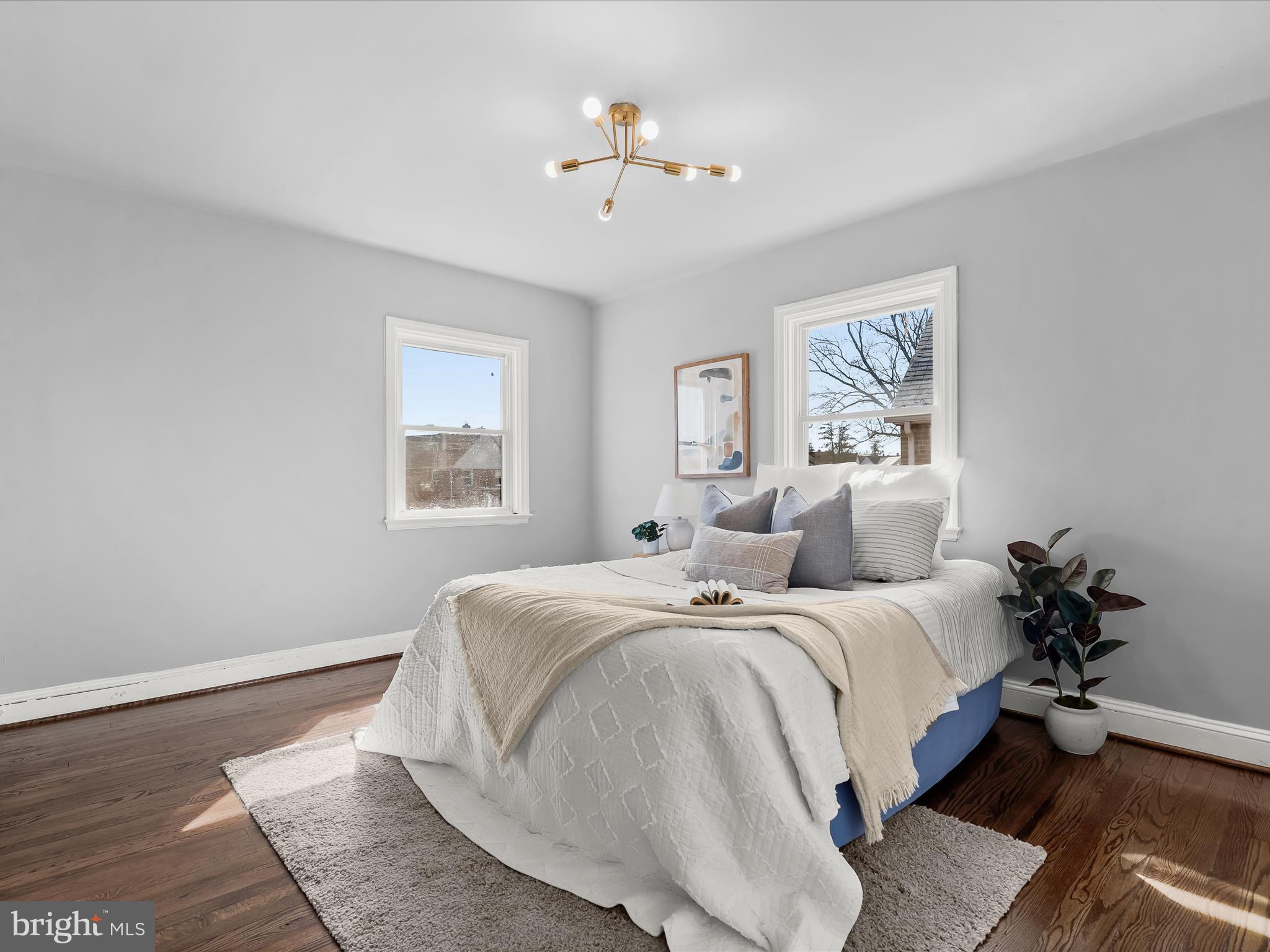 1350 Pentwood Road Baltimore, MD 21239 - Photo 20 of 37 a bedroom with bed painting on the wall and a window