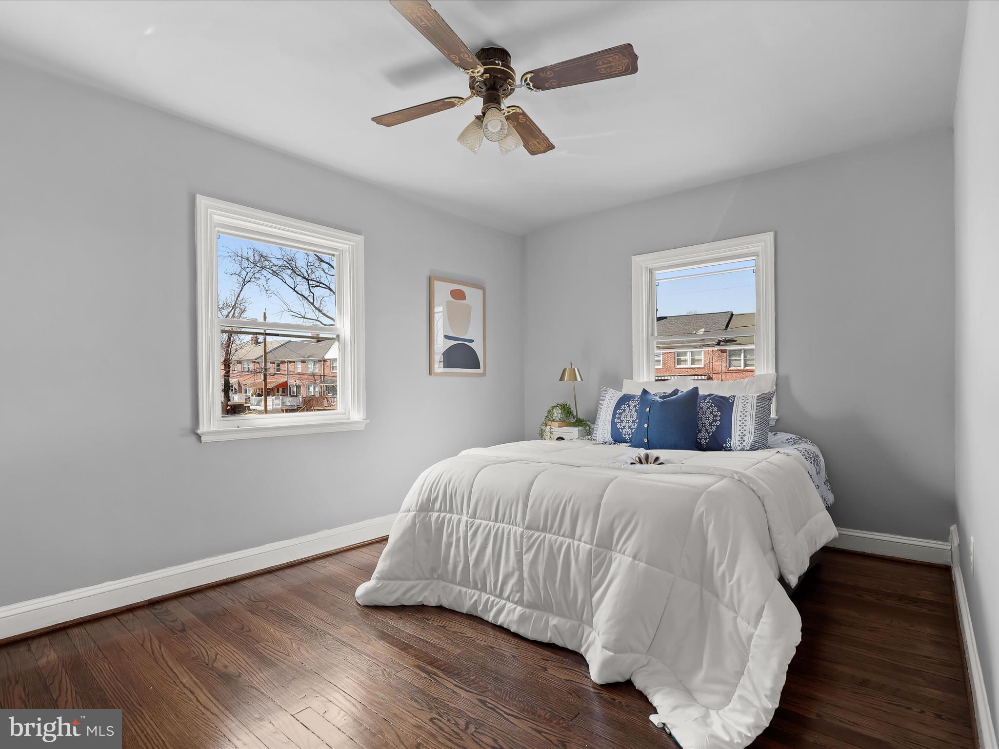 1350 Pentwood Road Baltimore, MD 21239 - Photo 24 of 37 a bedroom with a bed and wooden floor