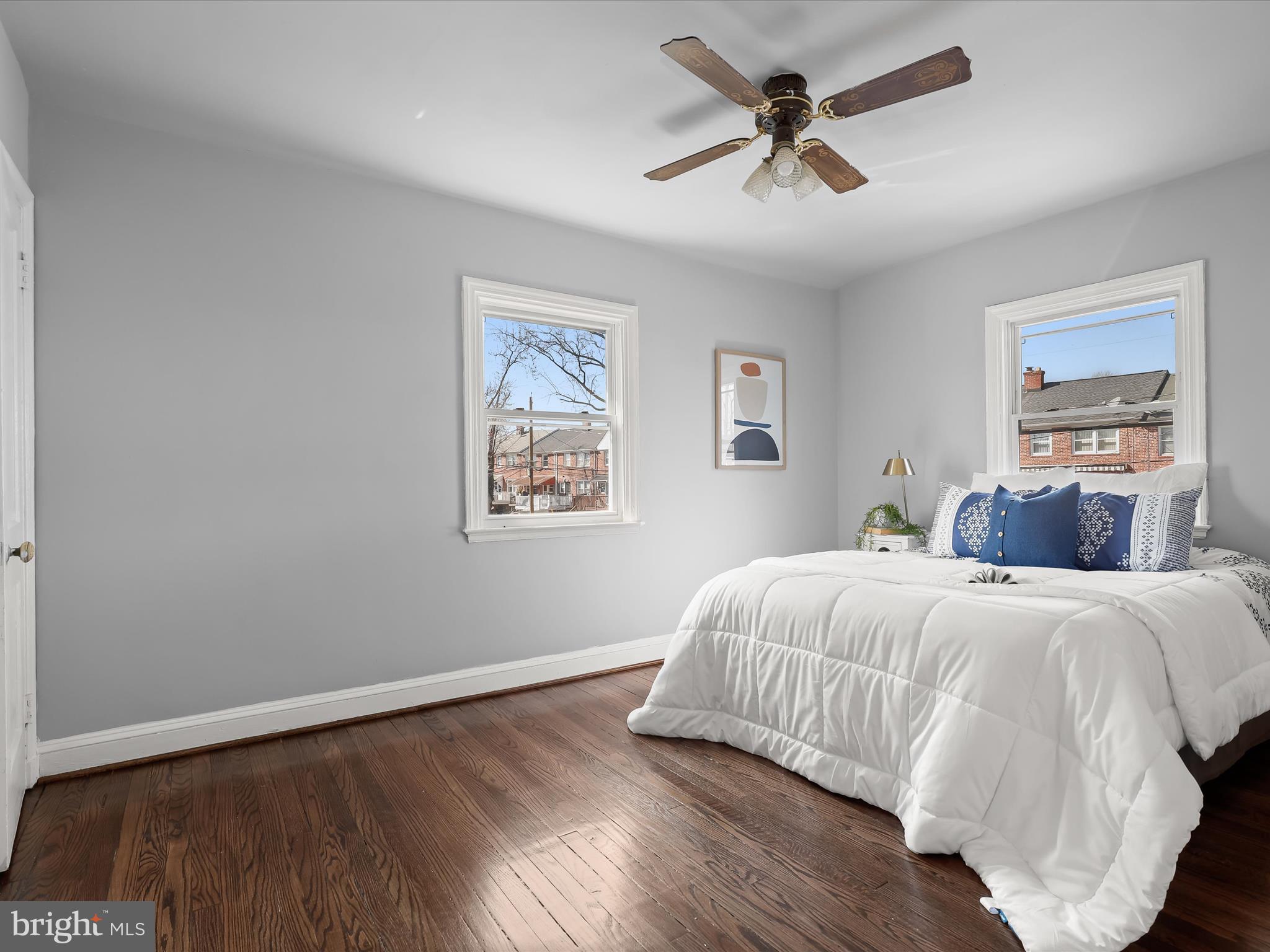 1350 Pentwood Road Baltimore, MD 21239 - Photo 25 of 37 a bedroom with a bed and a painting on the wall