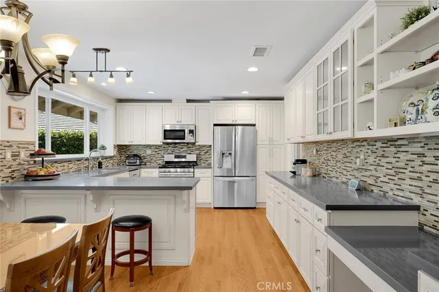 a kitchen with cabinets and a stove