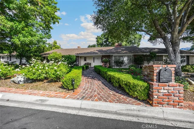 front view of a house with a garden
