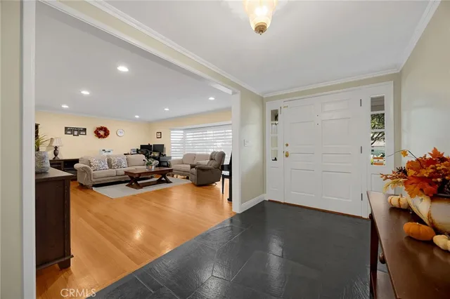 a view of a living room and kitchen