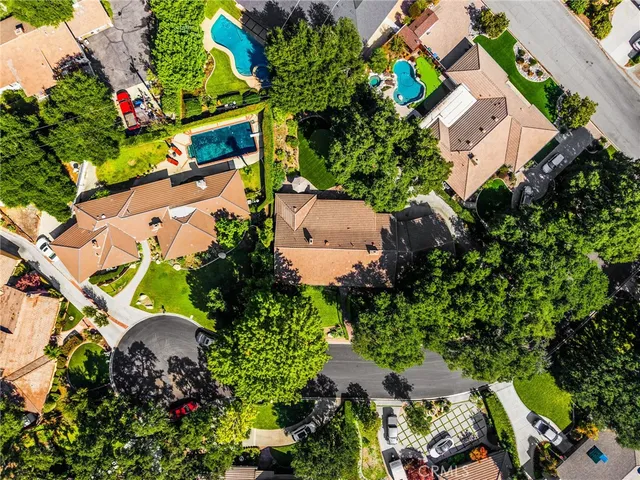 an aerial view of a house with a yard and a garden