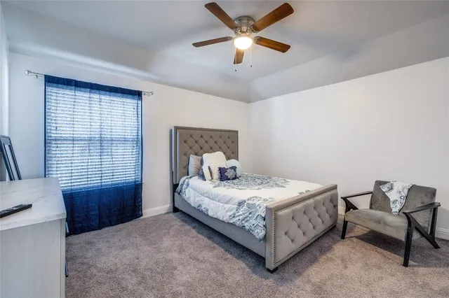 a bedroom with furniture and a window