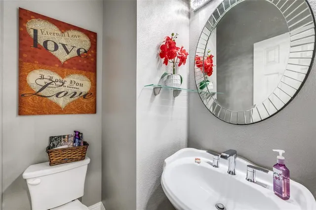 a kitchen with granite countertop stainless steel appliances and wooden cabinets