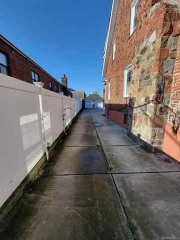 a view of a pathway both side of building