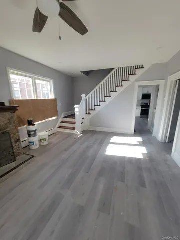 a kitchen with refrigerator and cabinets