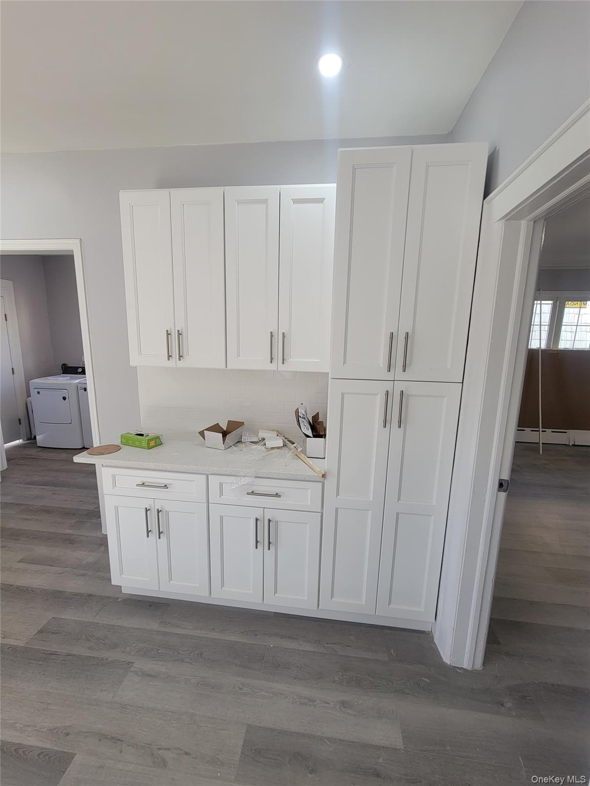 315 Mill Road Hewlett, NY 11557 - Photo 10 of 12 a view of white cabinets with wooden floor