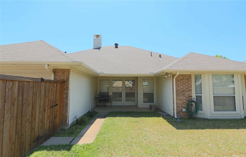 6019 Mapleshade Lane Dallas, TX 75252 - Photo 15 of 18 Backyard with covered patio