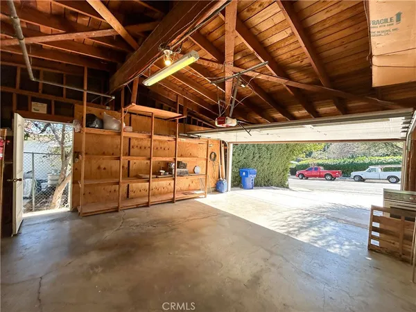 a view of a room with wooden walls