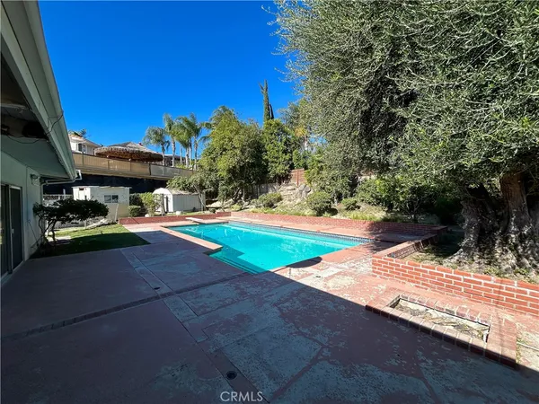 a view of outdoor space with swimming pool