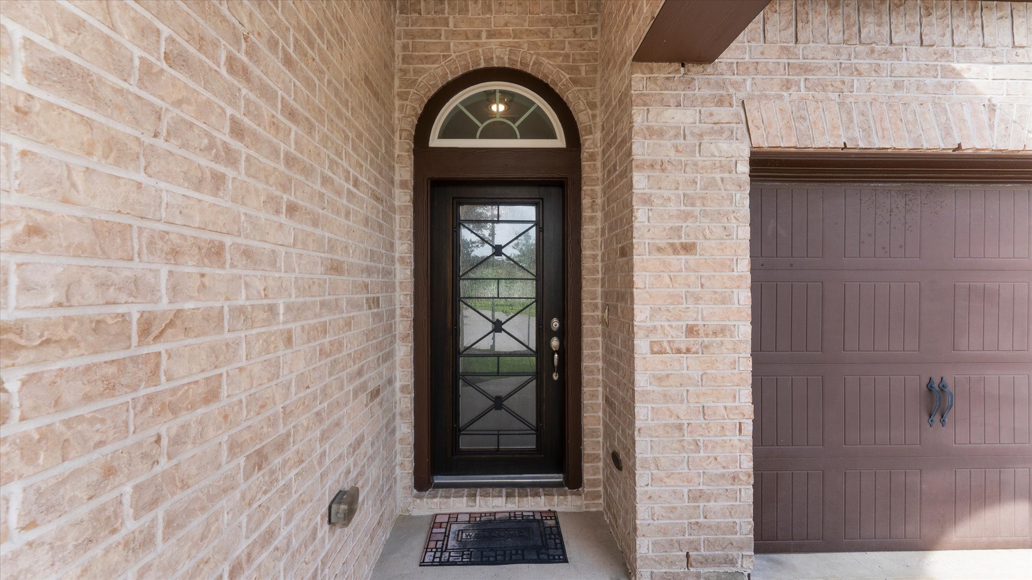 32001 Birch Briar Court Spring, TX 77386 - Photo 6 of 48 Welcoming covered front porch with an elegant front door and impressive architectural details that create a memorable first impression.