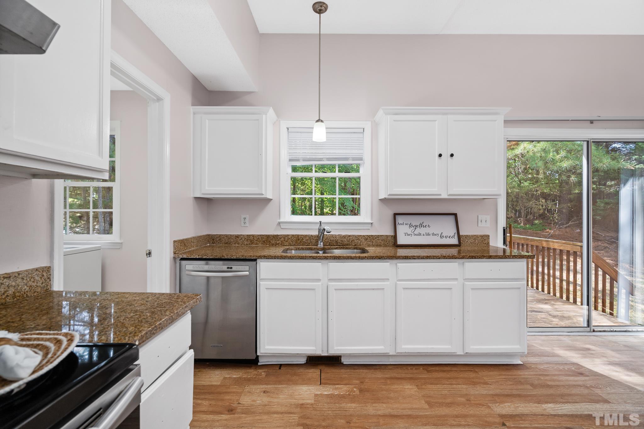 2201 Quail View Trail Raleigh, NC 27604 - Photo 11 of 28 a kitchen with stainless steel appliances granite countertop a stove a sink and a granite counter tops