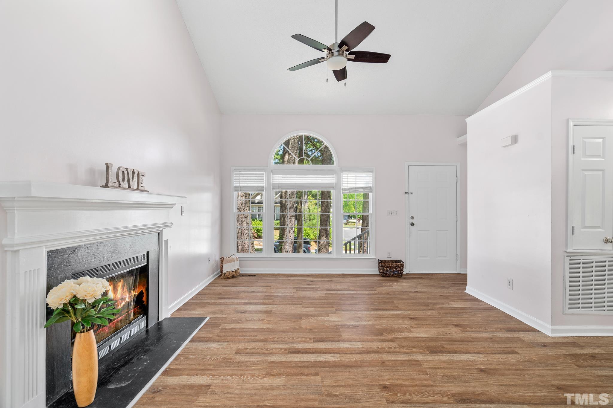 2201 Quail View Trail Raleigh, NC 27604 - Photo 5 of 28 a view of an empty room with a fireplace and a window
