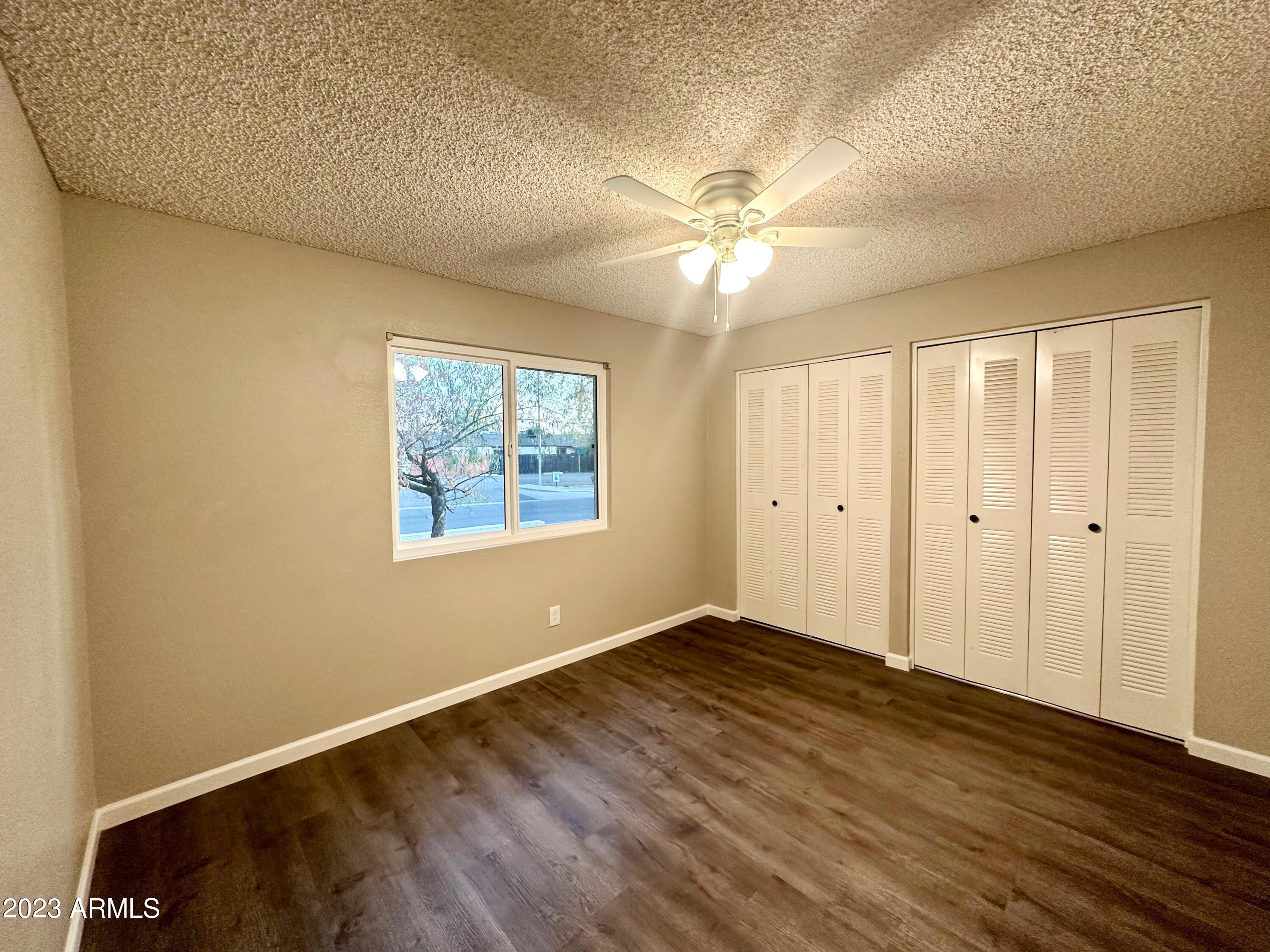 6711 West Osborn Road, Unit 117 Phoenix, AZ 85033 - Photo 5 of 17 Front Bedroom with large closets
