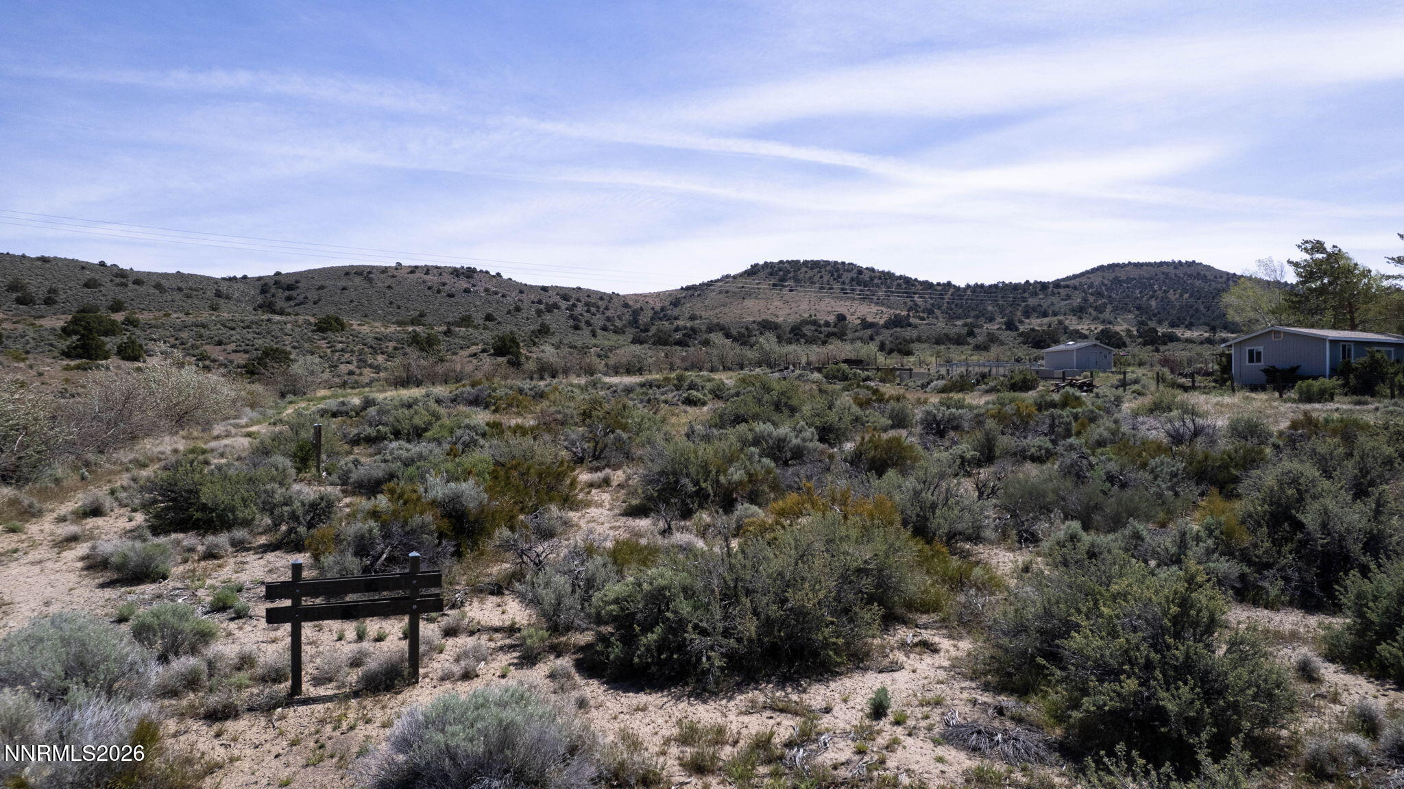 6260 Pursia Road Carson City, NV 89701 - Photo 13 of 26 a view of a green field with mountains in the background