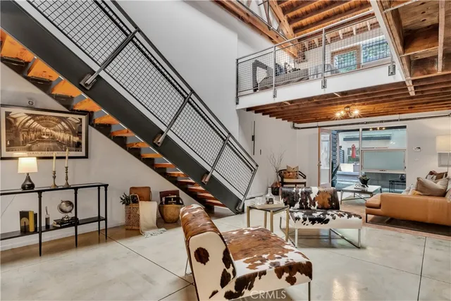 a view of a dining room with furniture and a chandelier