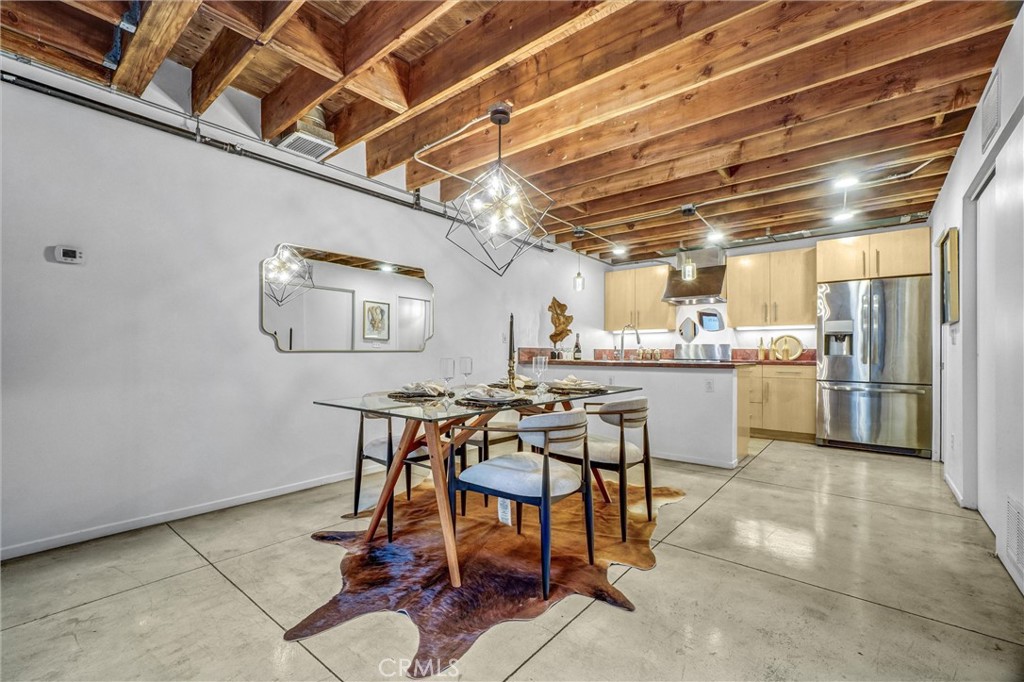 849 Pine Avenue, Unit C Long Beach, CA 90813 - Photo 13 of 63 a kitchen with a table and chairs in it