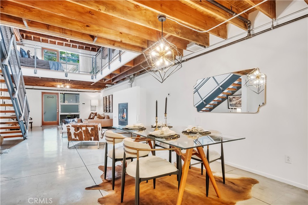 849 Pine Avenue, Unit C Long Beach, CA 90813 - Photo 15 of 63 a view of a dining room with furniture a chandelier and wooden floor