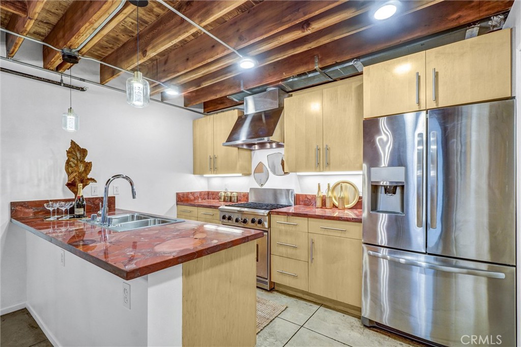 849 Pine Avenue, Unit C Long Beach, CA 90813 - Photo 17 of 63 a kitchen with stainless steel appliances granite countertop a refrigerator a stove and a sink