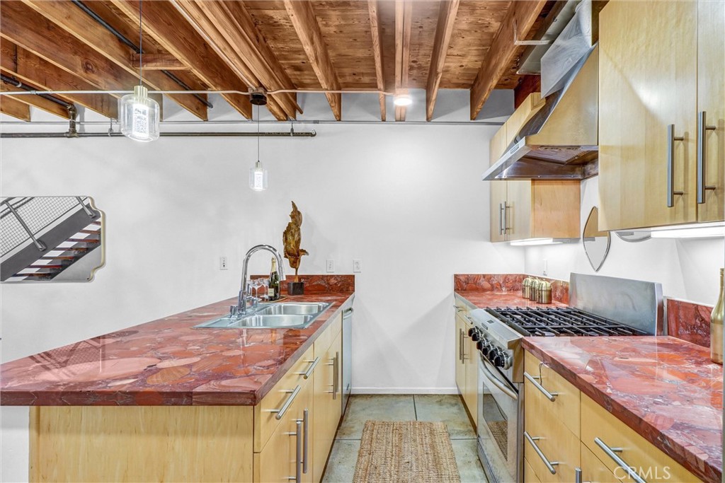 849 Pine Avenue, Unit C Long Beach, CA 90813 - Photo 22 of 63 a kitchen with a stove and a sink