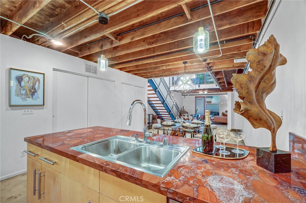 849 Pine Avenue, Unit C Long Beach, CA 90813 - Photo 23 of 63 a kitchen with a sink and a wooden floor