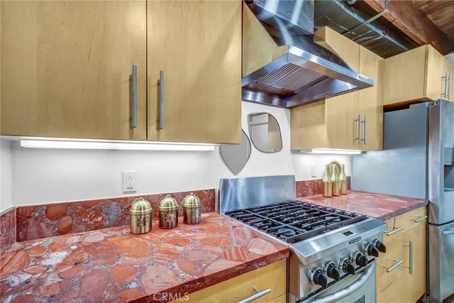 a view of a dining room with furniture a chandelier and wooden floor