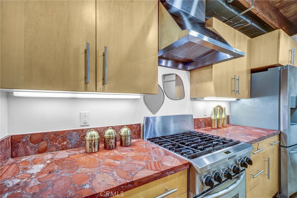 849 Pine Avenue, Unit C Long Beach, CA 90813 - Photo 24 of 63 a bedroom with a bed and dresser