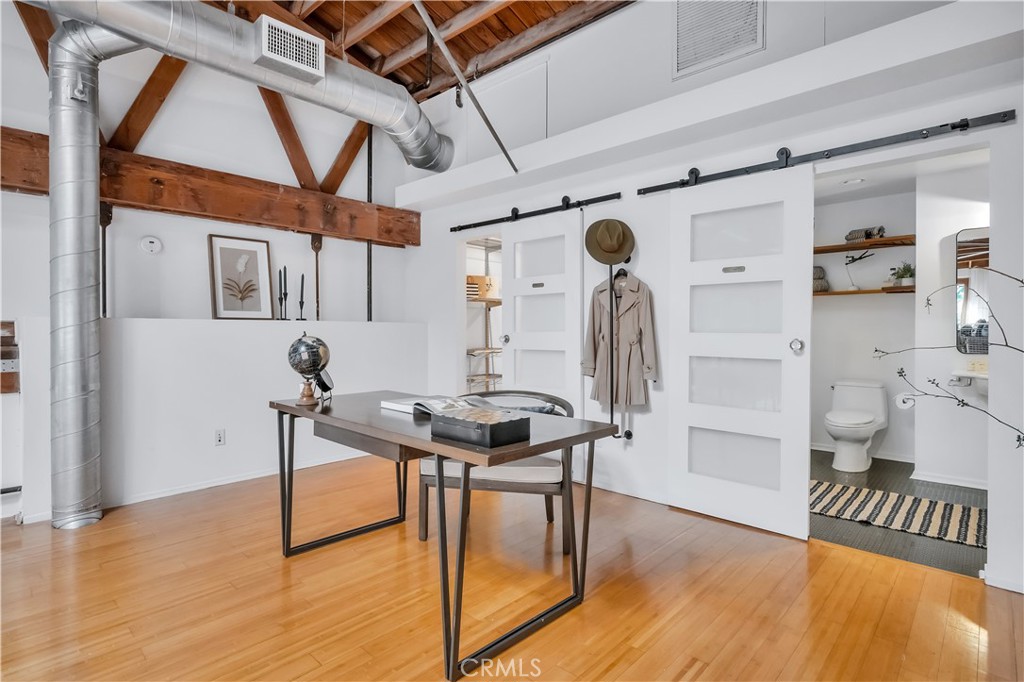 849 Pine Avenue, Unit C Long Beach, CA 90813 - Photo 27 of 63 a view of a room with wooden floor and furniture