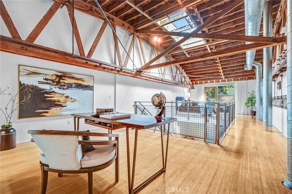 849 Pine Avenue, Unit C Long Beach, CA 90813 - Photo 28 of 63 a view of a dining room with furniture a chandelier and wooden floor