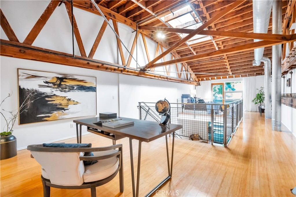 849 Pine Avenue, Unit C Long Beach, CA 90813 - Photo 29 of 63 a dining room with furniture and wooden floor