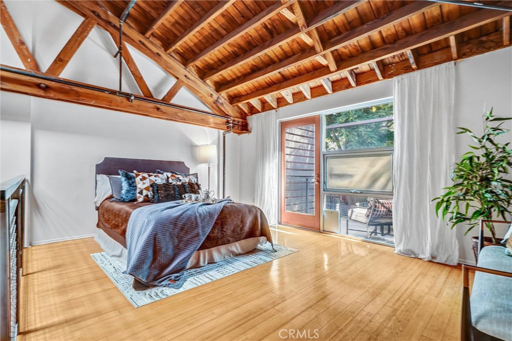 849 Pine Avenue, Unit C Long Beach, CA 90813 - Photo 35 of 63 a bedroom with a bed and a large window