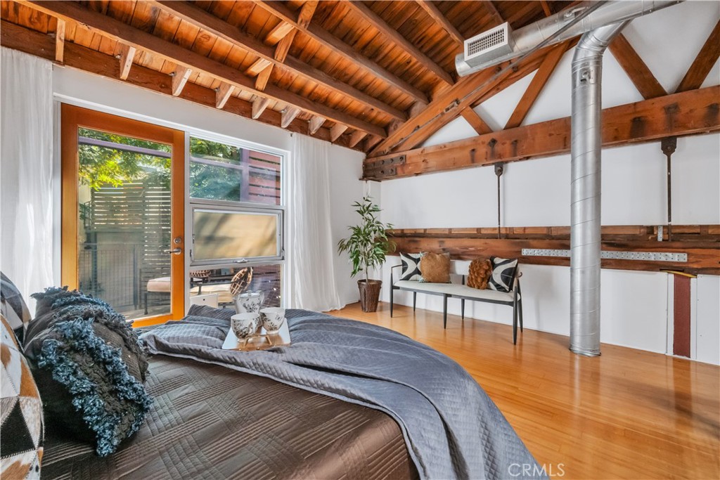 849 Pine Avenue, Unit C Long Beach, CA 90813 - Photo 38 of 63 a bed room with furniture and floor to ceiling windows