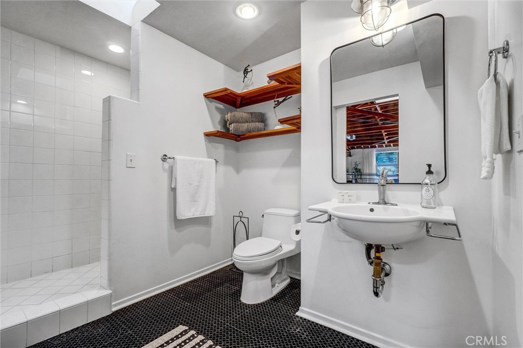 849 Pine Avenue, Unit C Long Beach, CA 90813 - Photo 39 of 63 a bathroom with a sink toilet and shower