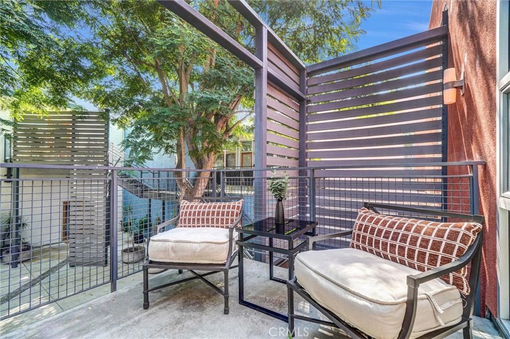 849 Pine Avenue, Unit C Long Beach, CA 90813 - Photo 42 of 63 a view of a patio with a table and chairs and couches