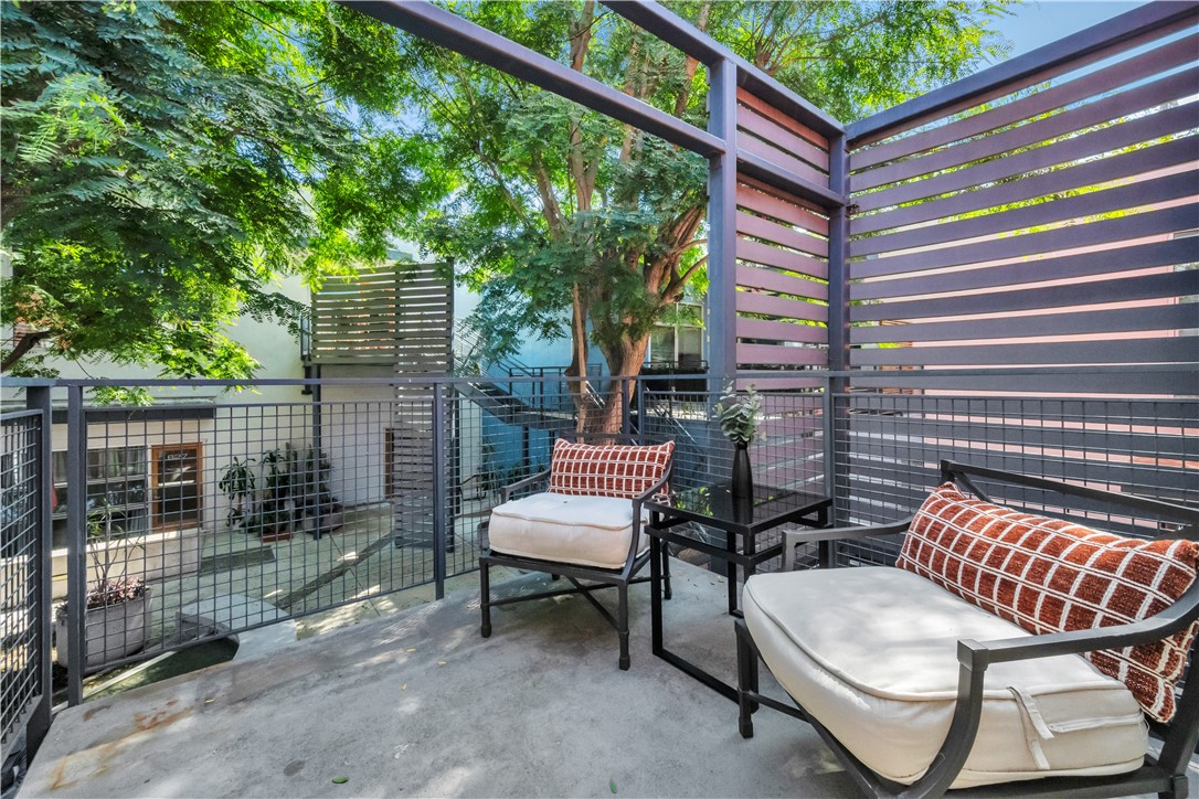 849 Pine Avenue, Unit C Long Beach, CA 90813 - Photo 43 of 63 a view of a chair and table in the back yard