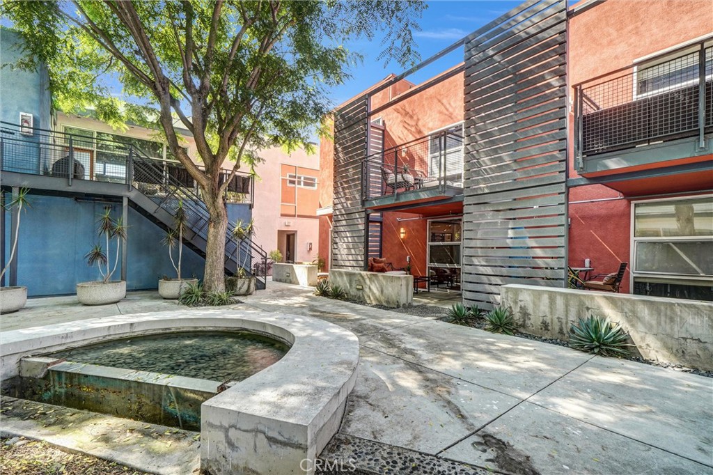 849 Pine Avenue, Unit C Long Beach, CA 90813 - Photo 47 of 63 a view of a house with backyard tub and tree