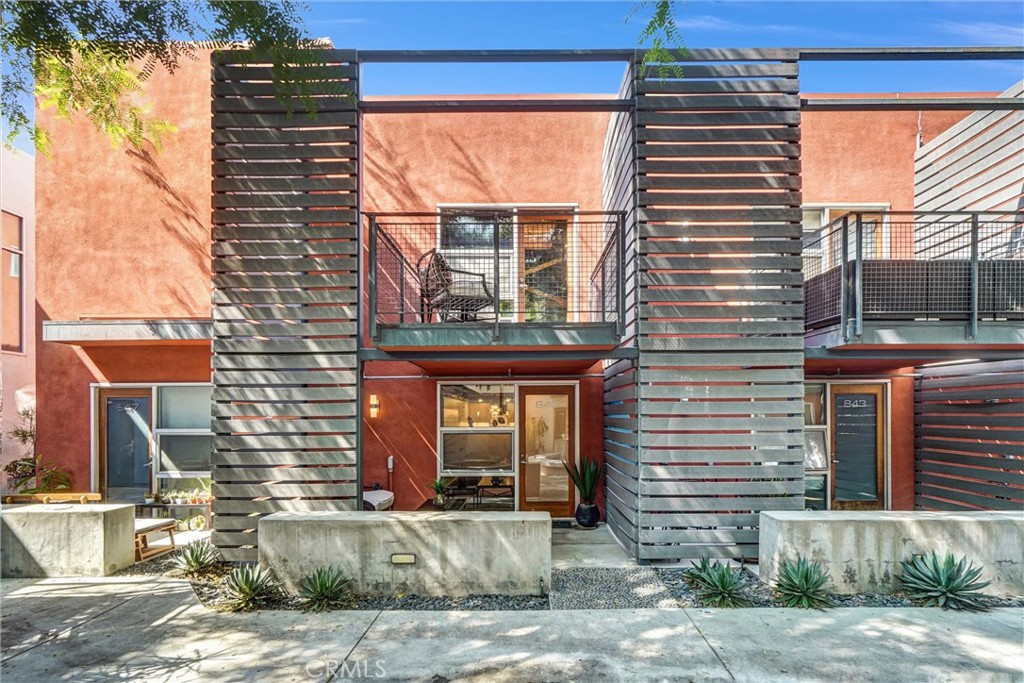 849 Pine Avenue, Unit C Long Beach, CA 90813 - Photo 53 of 63 a front view of a house with a yard