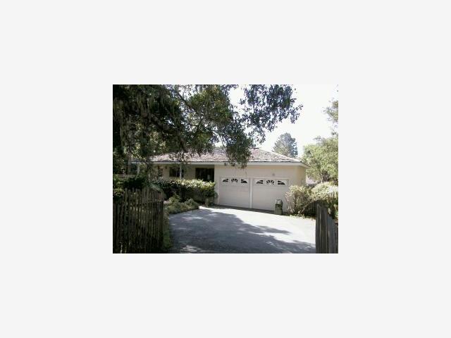 1046 Ocean Road Pebble Beach, CA 93953 - Photo 1 of 1 a picture of a bench in a backyard