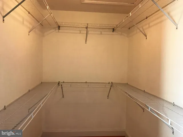 a view of a room with racks on the wall