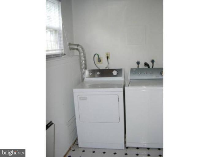 2390 Hunters Square Court Reston, VA 20191 - Photo 12 of 15 a utility room with dryer and washer