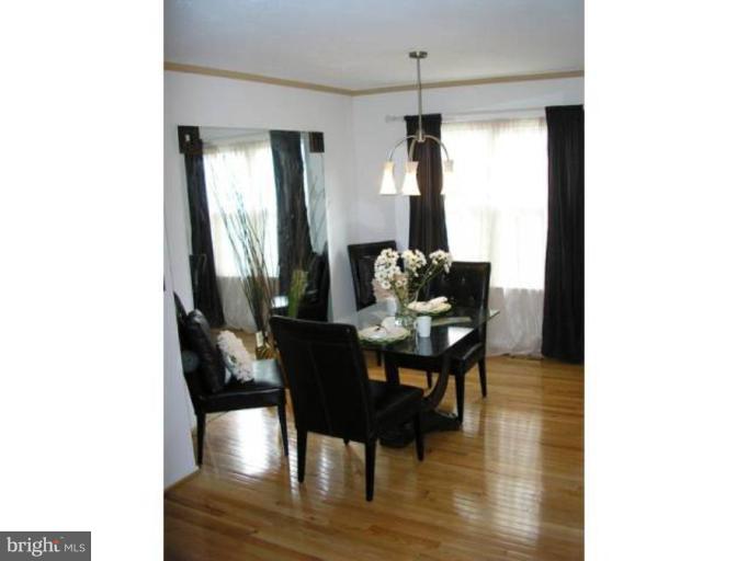 2390 Hunters Square Court Reston, VA 20191 - Photo 3 of 15 a dining room with furniture and wooden floor
